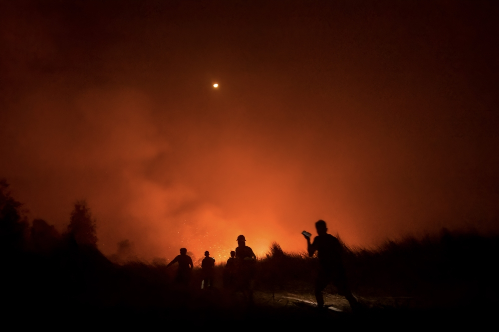 Malaysia pushes to fast-track Indonesia talks on forest fire aid as haze worsens